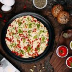 fried-eggs-with-sliced-vegetables-herbs_140725-6162